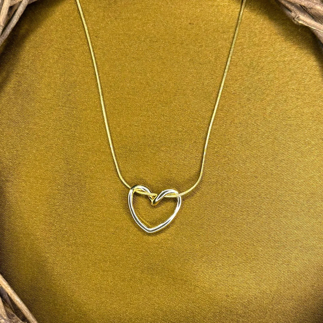 Tivona Open-Heart Pendant resting on a chain bathed in 18K Gold Plated light
