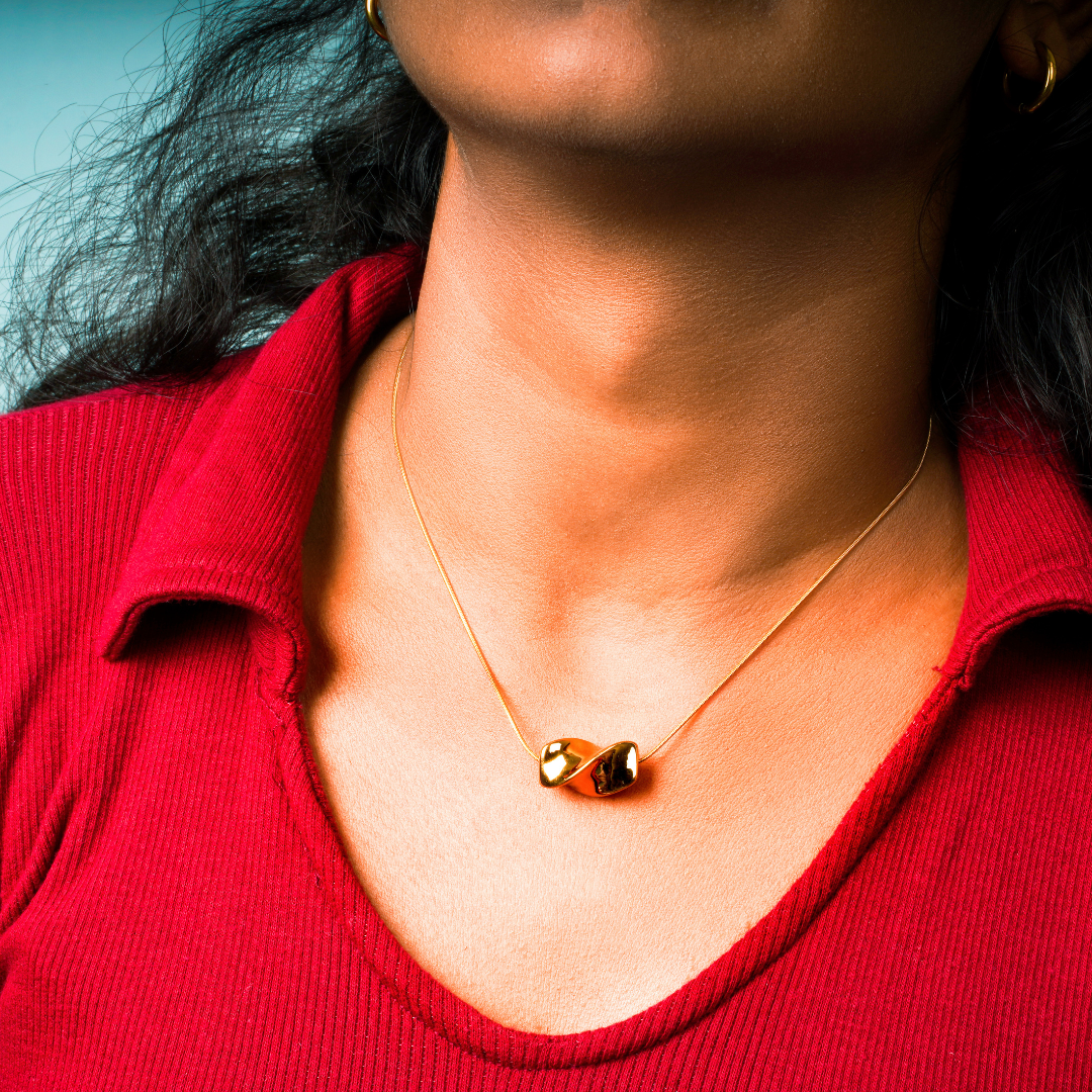 Aurelia – A celestial knot-inspired pendant, suspended on a stainless steel chain