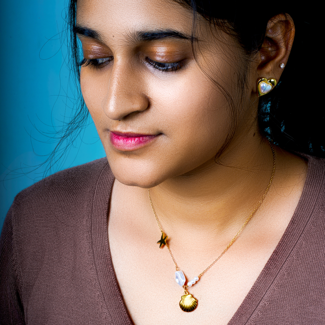 From ocean depths to life-giving pearls, this stainless steel chain radiates vibrant energy