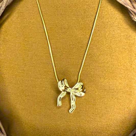Liora - Stainless steel chain with sculpted ribbon bow pendant