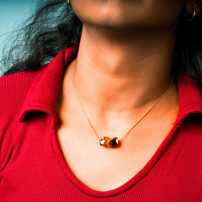 Aurelia – A celestial knot-inspired pendant, suspended on a stainless steel chain