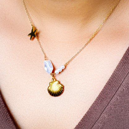 From ocean depths to life-giving pearls, this stainless steel chain radiates vibrant energy