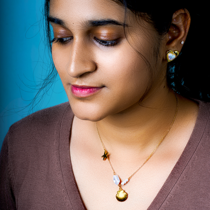 From ocean depths to life-giving pearls, this stainless steel chain radiates vibrant energy