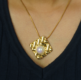 Ciela – A symbol of life, light, and clarity, delicately suspended on stainless steel