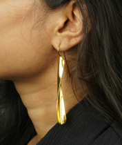 Dina Earrings – A golden twist of sculpted brass